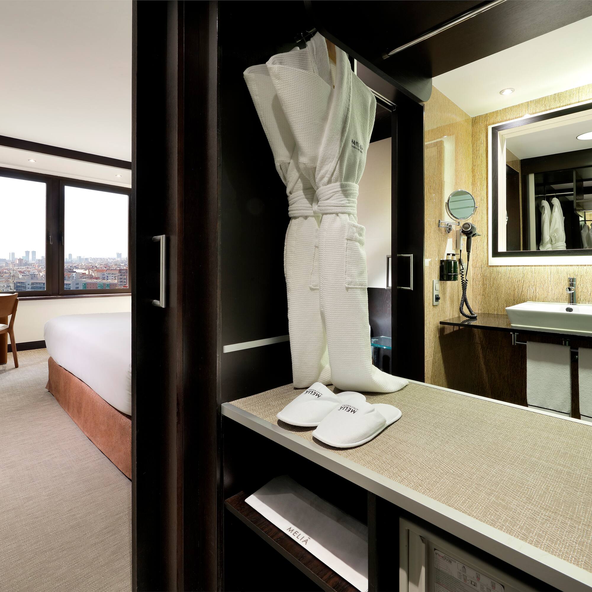 a white robe and slippers in a room