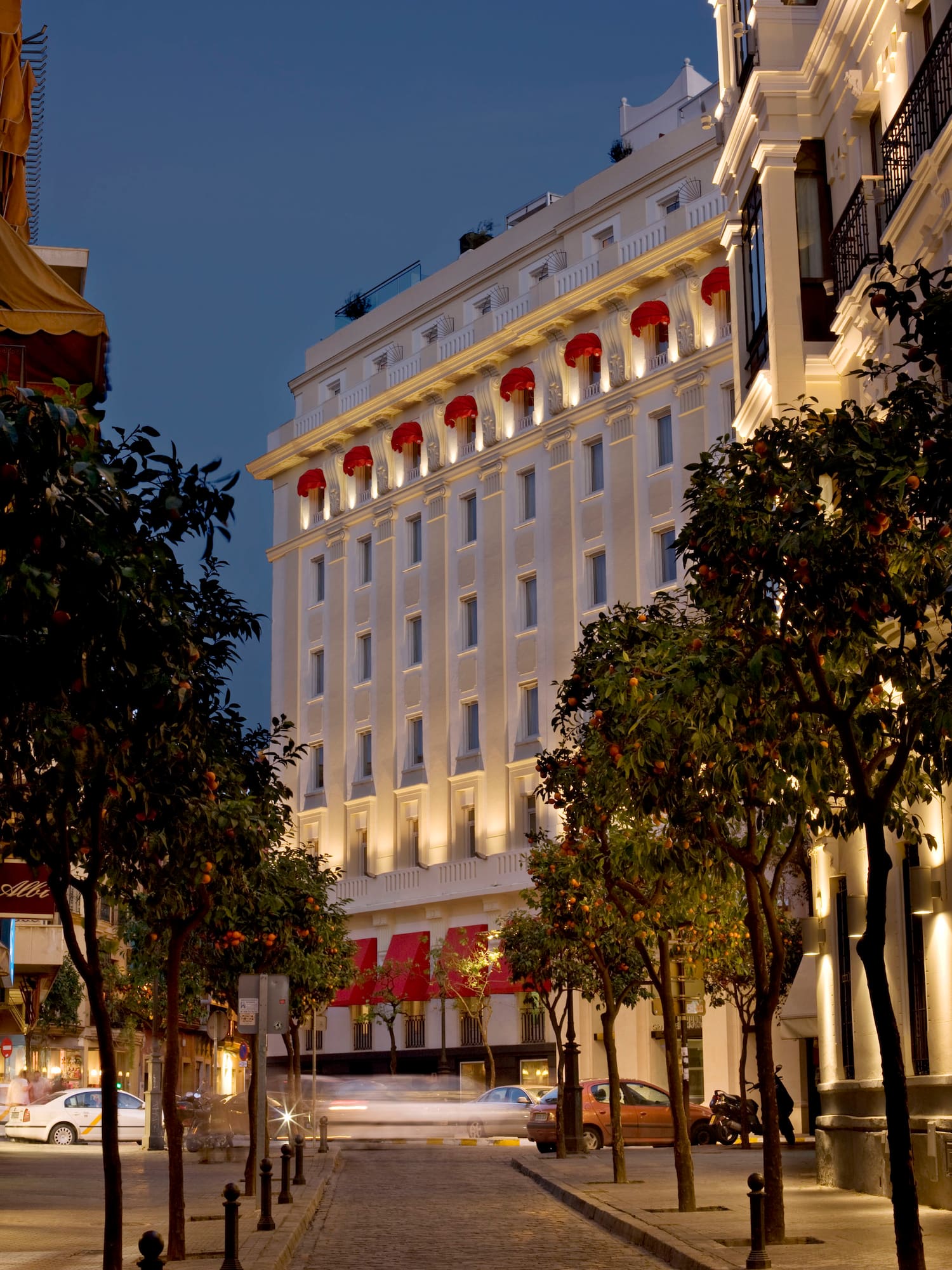 a building with lights on the side of the street