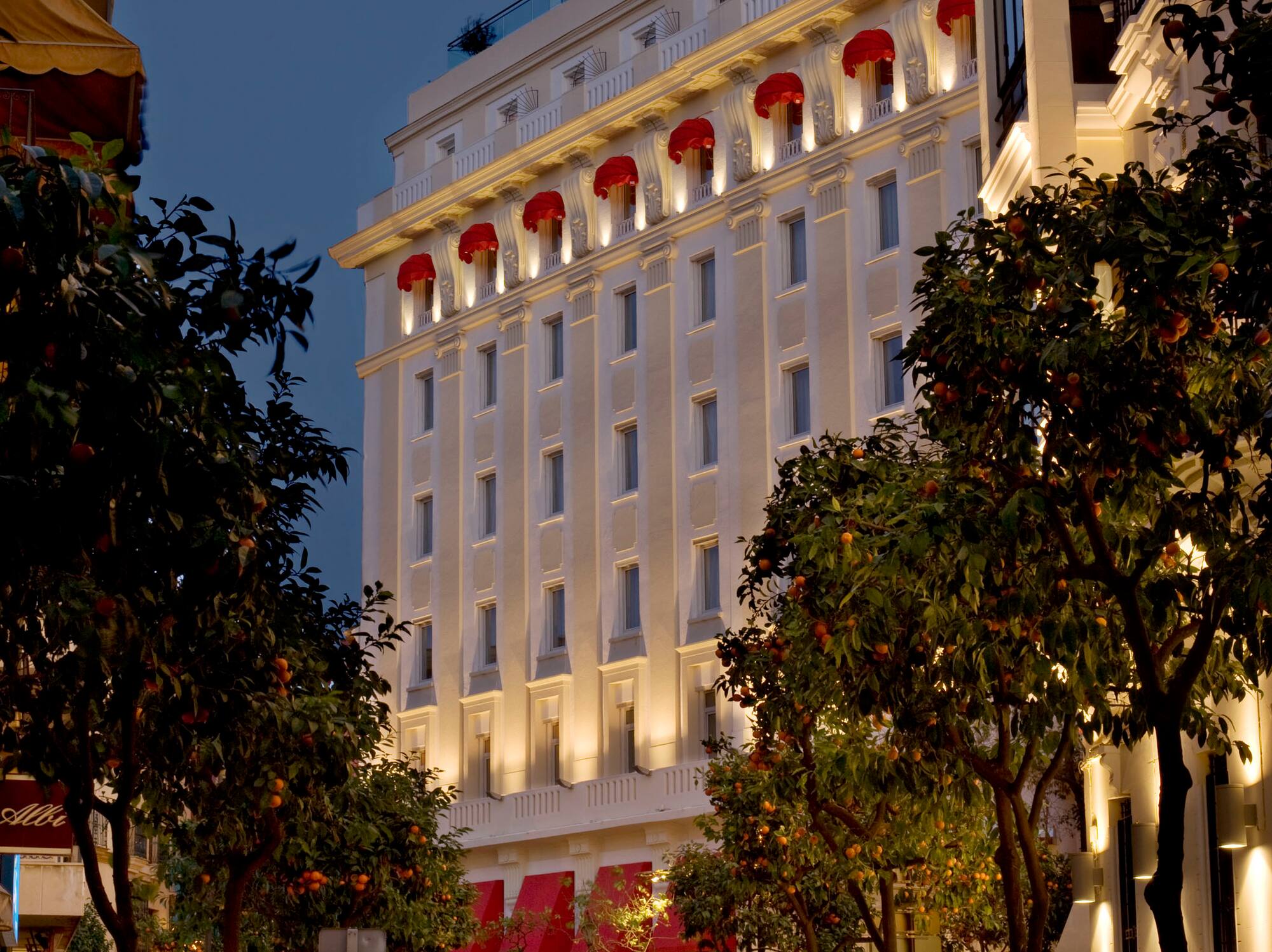 a building with lights on the side of the street
