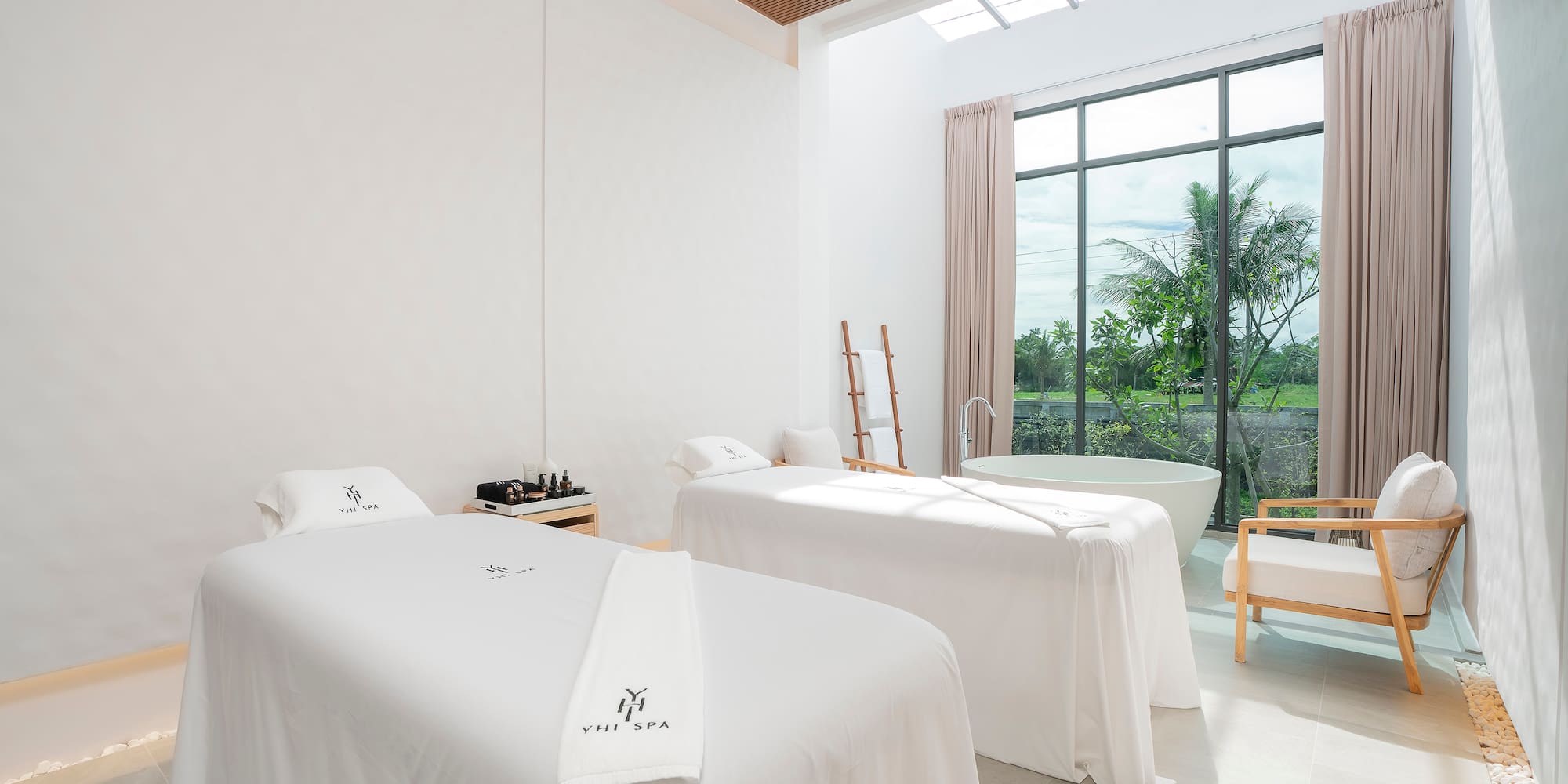 a room with beds and a tub