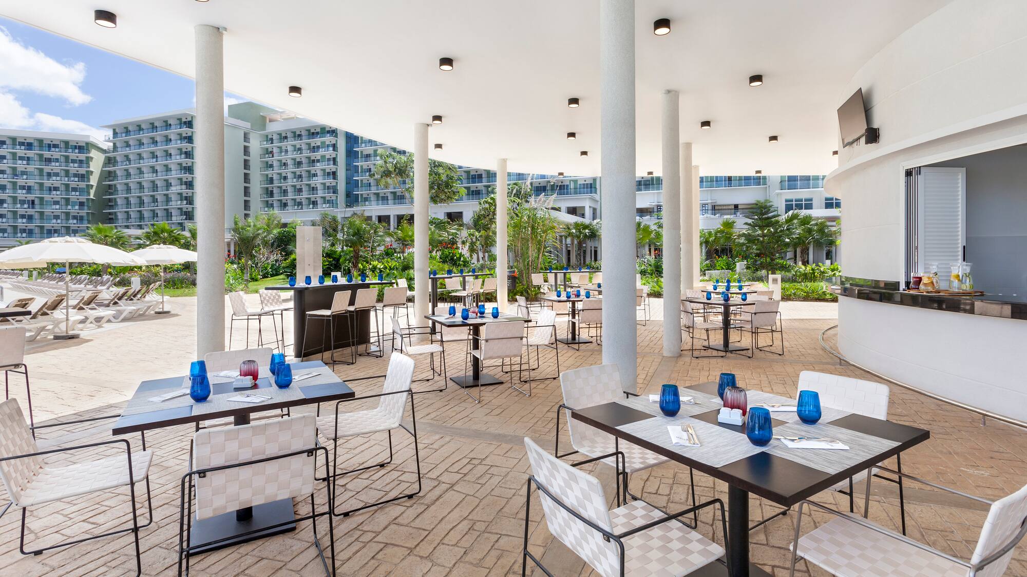 a patio with tables and chairs