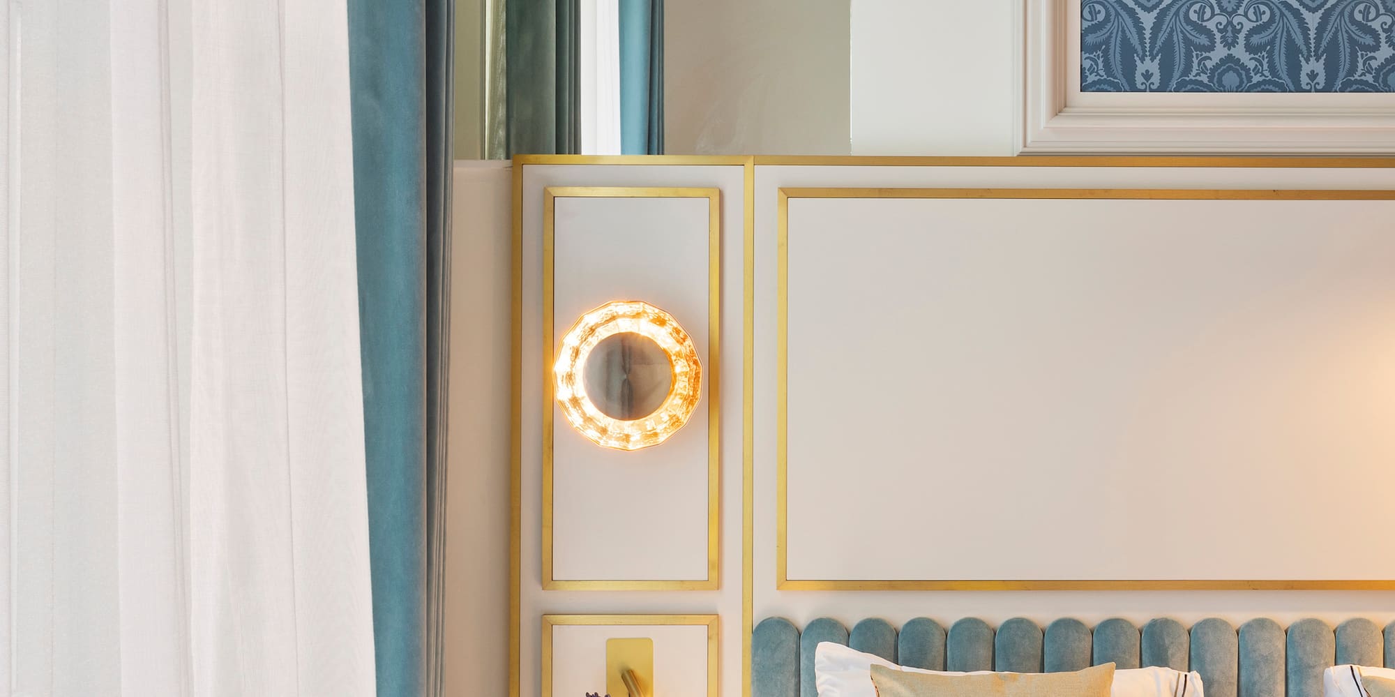 a bed with a mirror and a tray of flowers