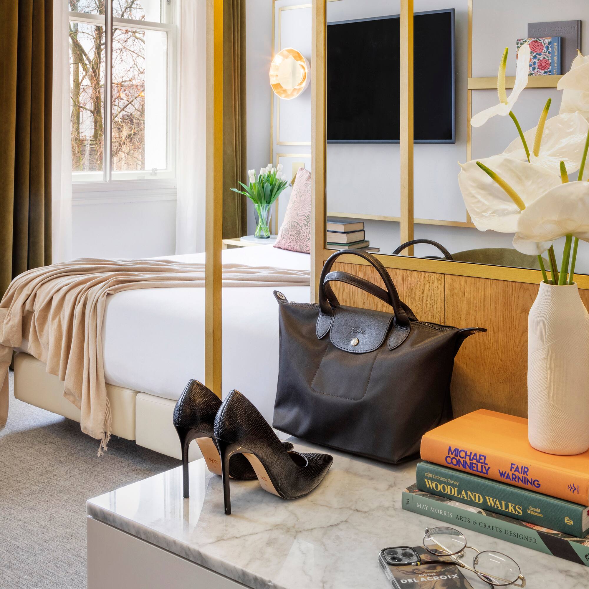 a room with a bed and a bed and a bed with a bed and a mirror