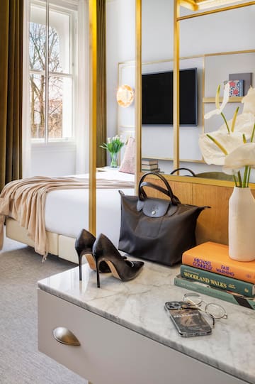 a room with a bed and a bed and a bed with a bed and a mirror