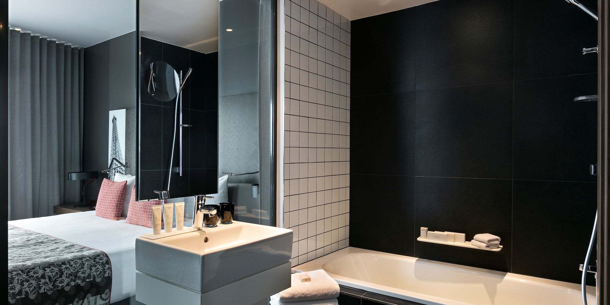 a bathroom with a bed and bathtub