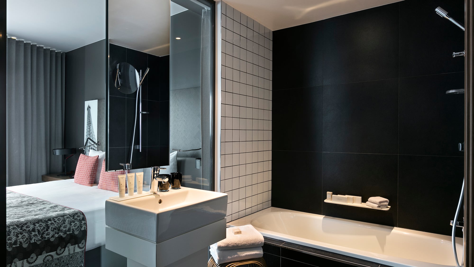 a bathroom with a bed and bathtub