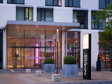 a building with glass walls and a sign