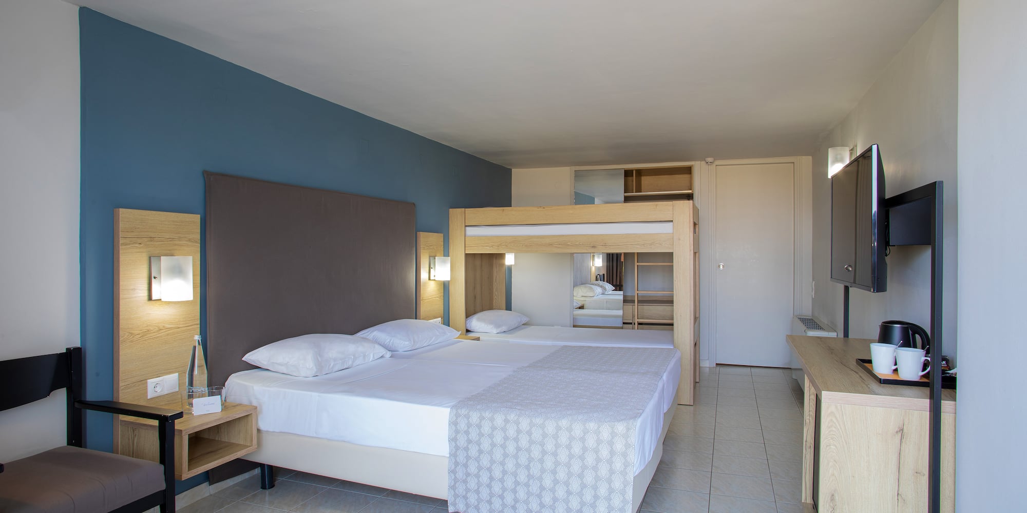 a room with a bed and a mirror