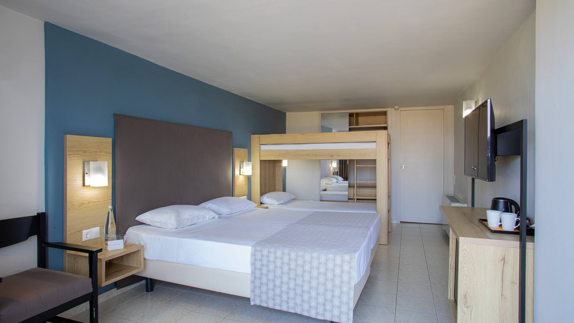 a room with a bed and a mirror