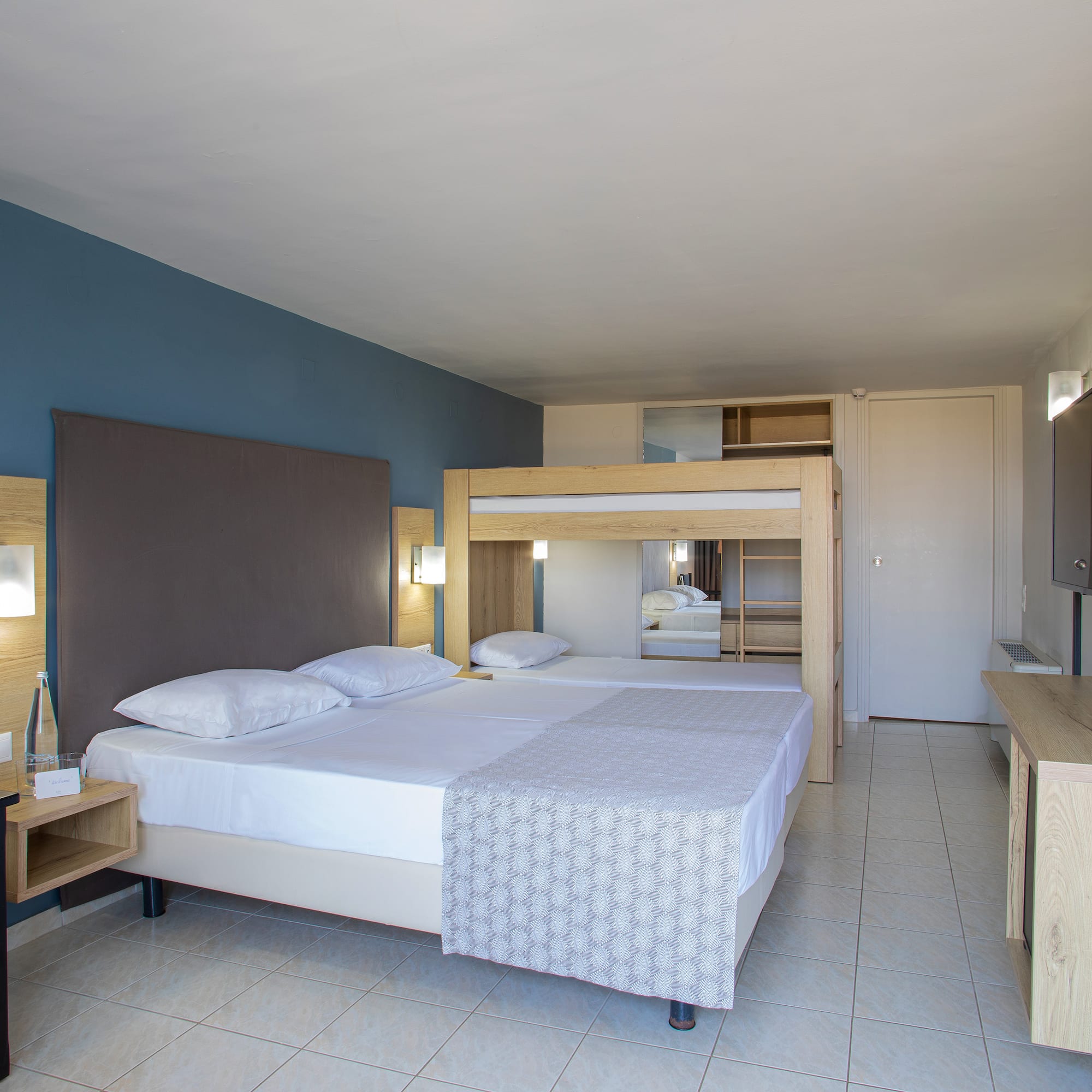 a room with a bed and a mirror