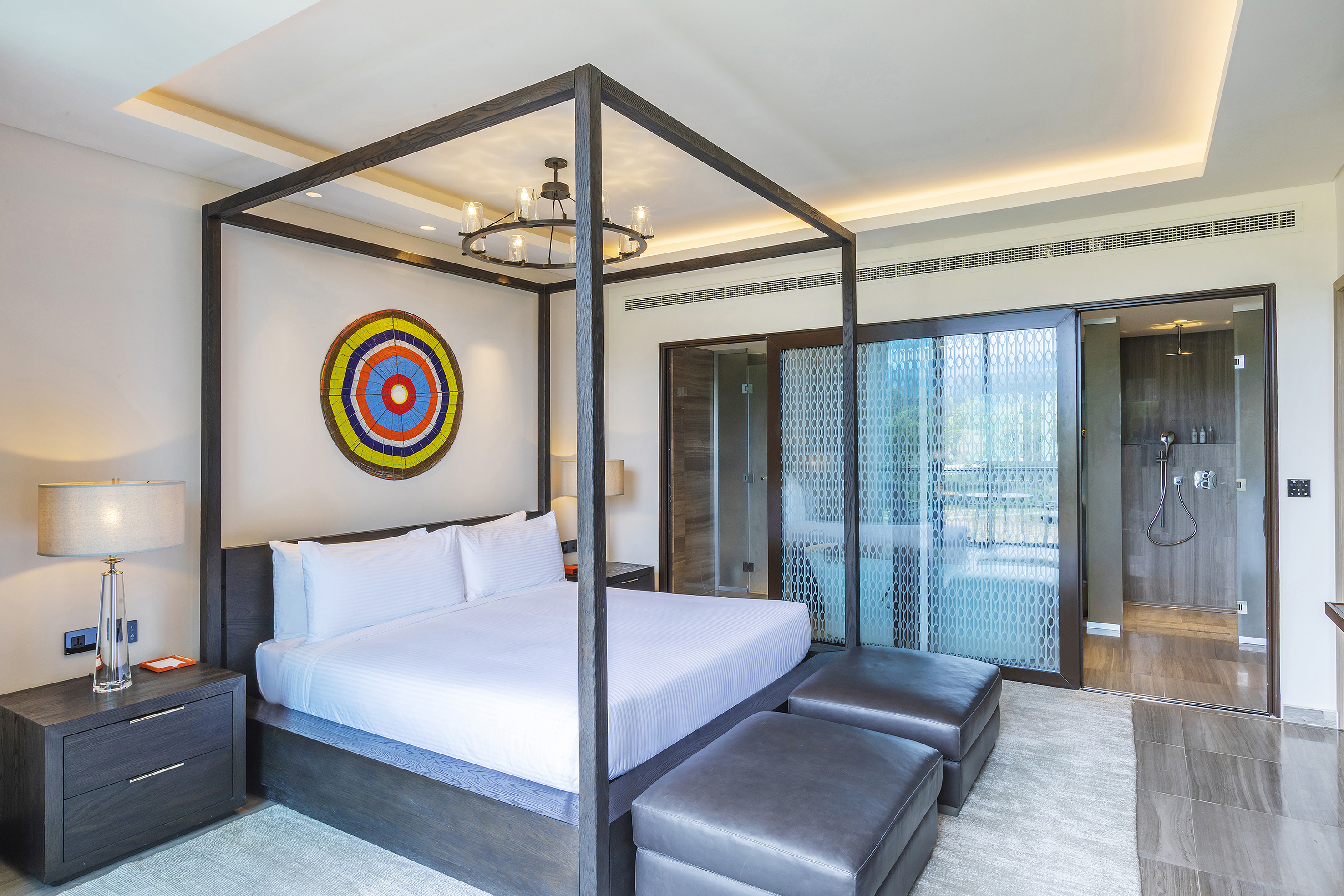 a bed with a four poster bed
