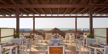 a restaurant with tables and chairs