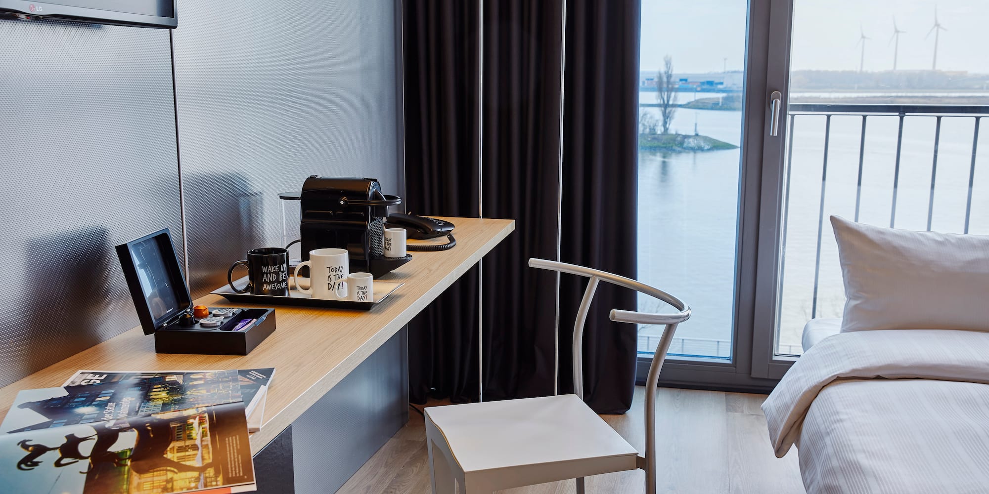 a desk with a chair and a laptop on it