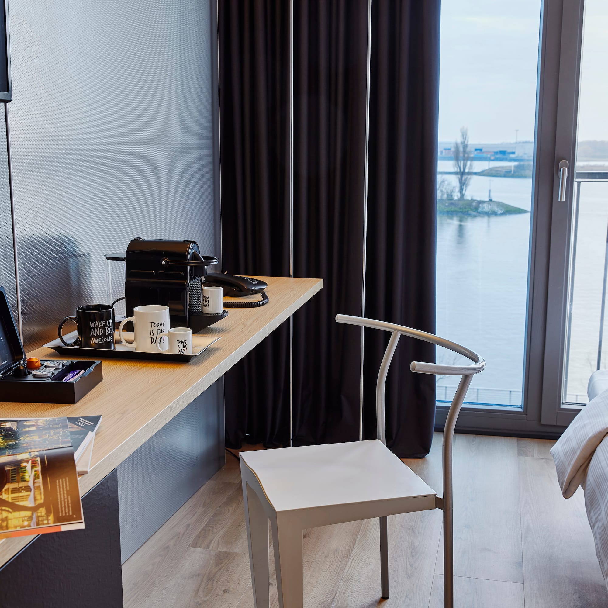 a desk with a chair and a laptop on it