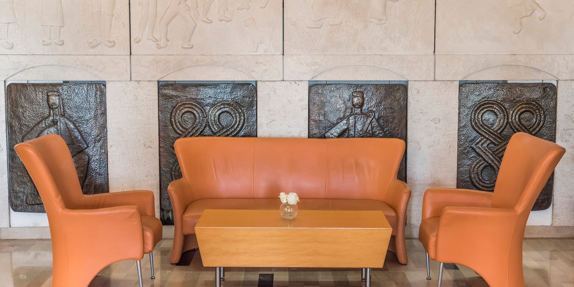 a couch and chairs in a room