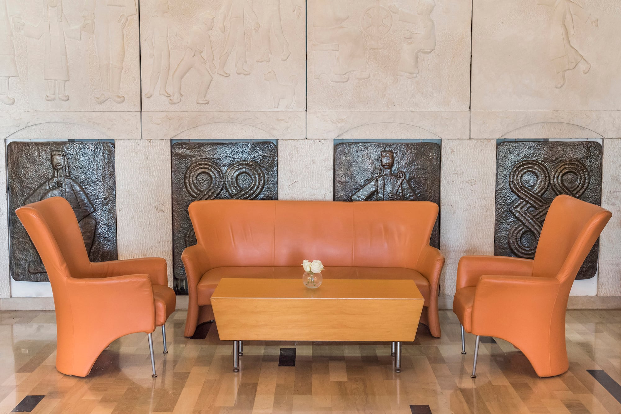 a couch and chairs in a room