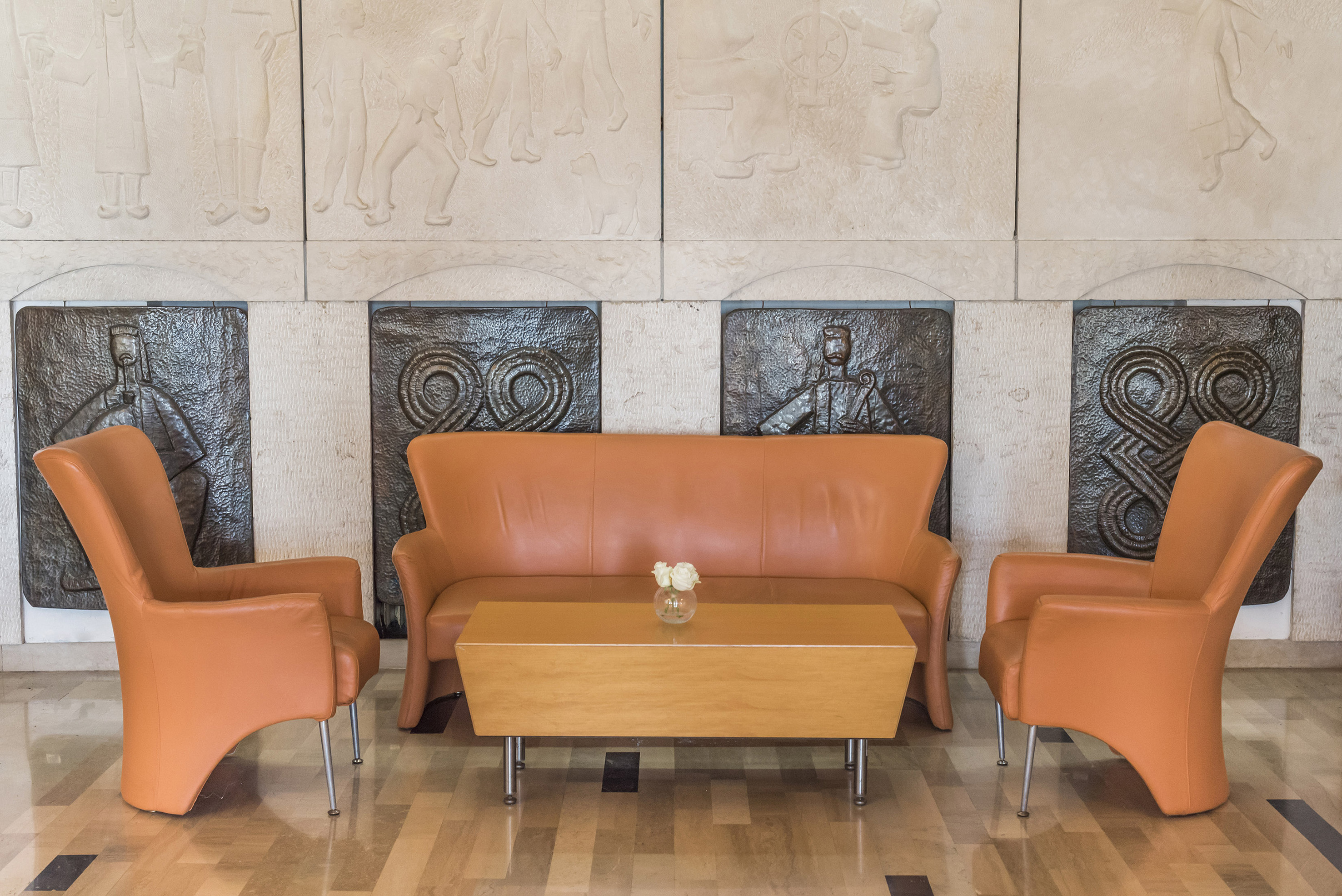 a couch and chairs in a room