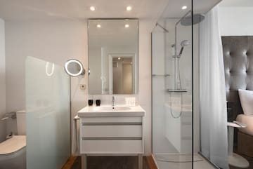 a bathroom with a shower and sink