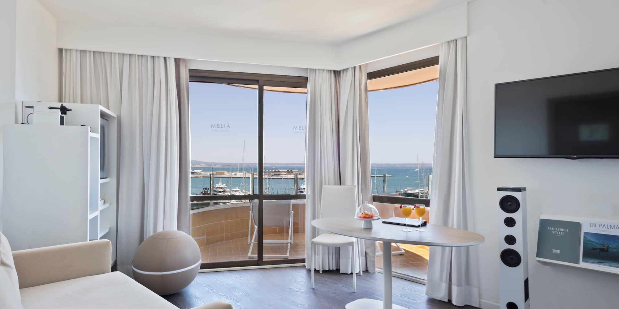 a room with a table and a television