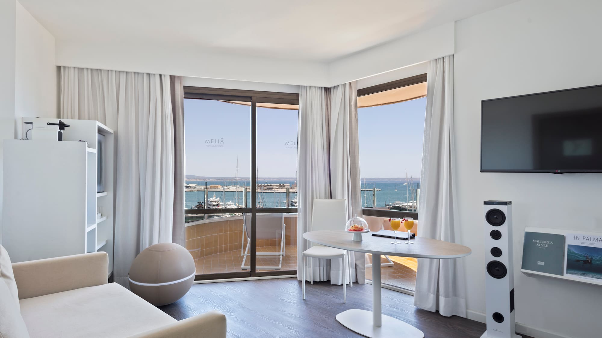 a room with a table and a television