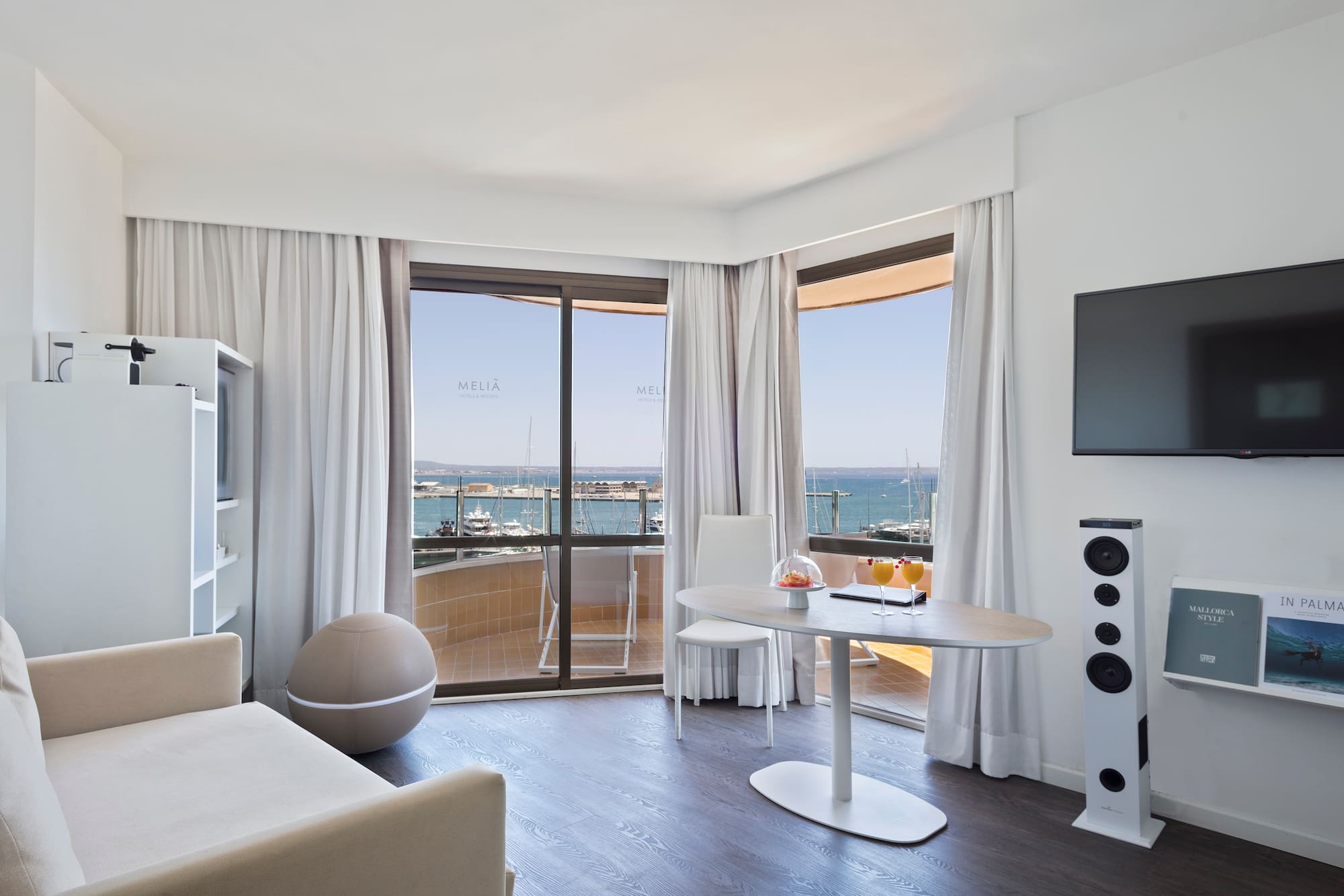 a room with a table and a television