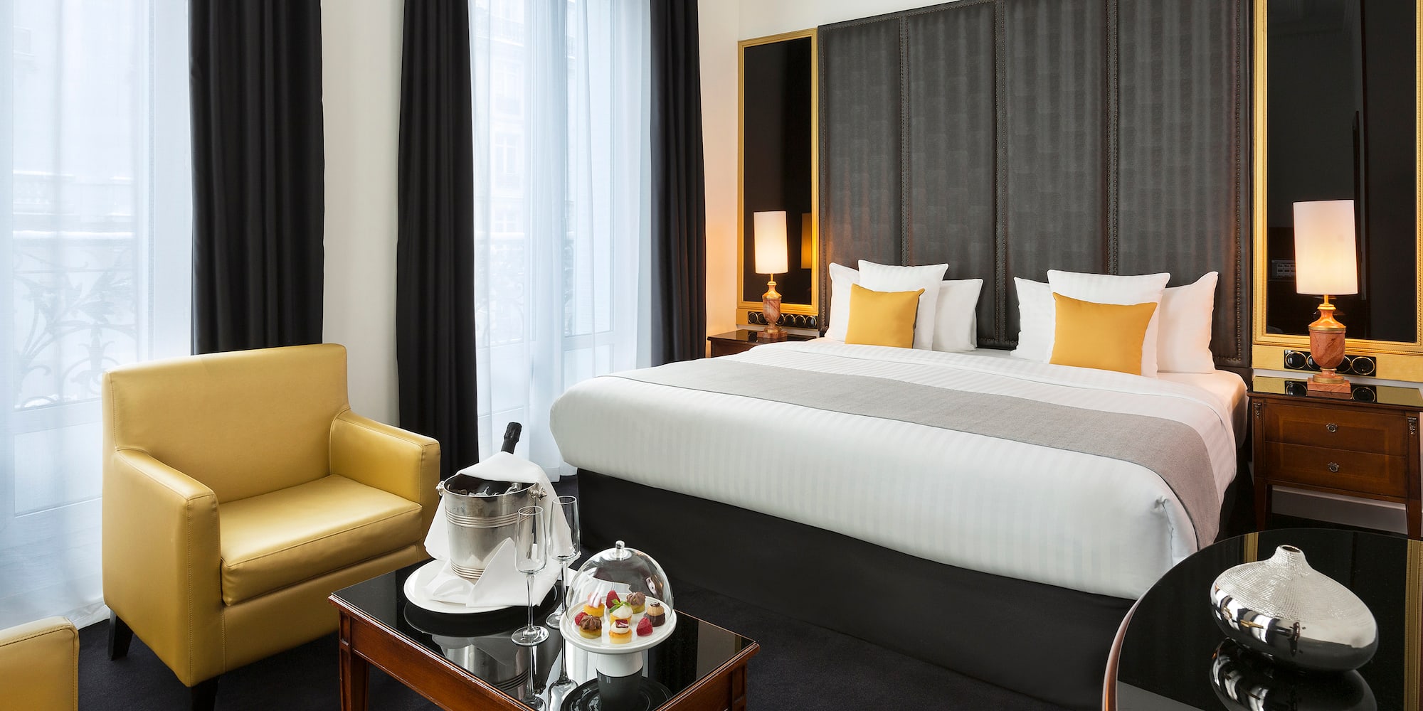 a room with a bed and a coffee table