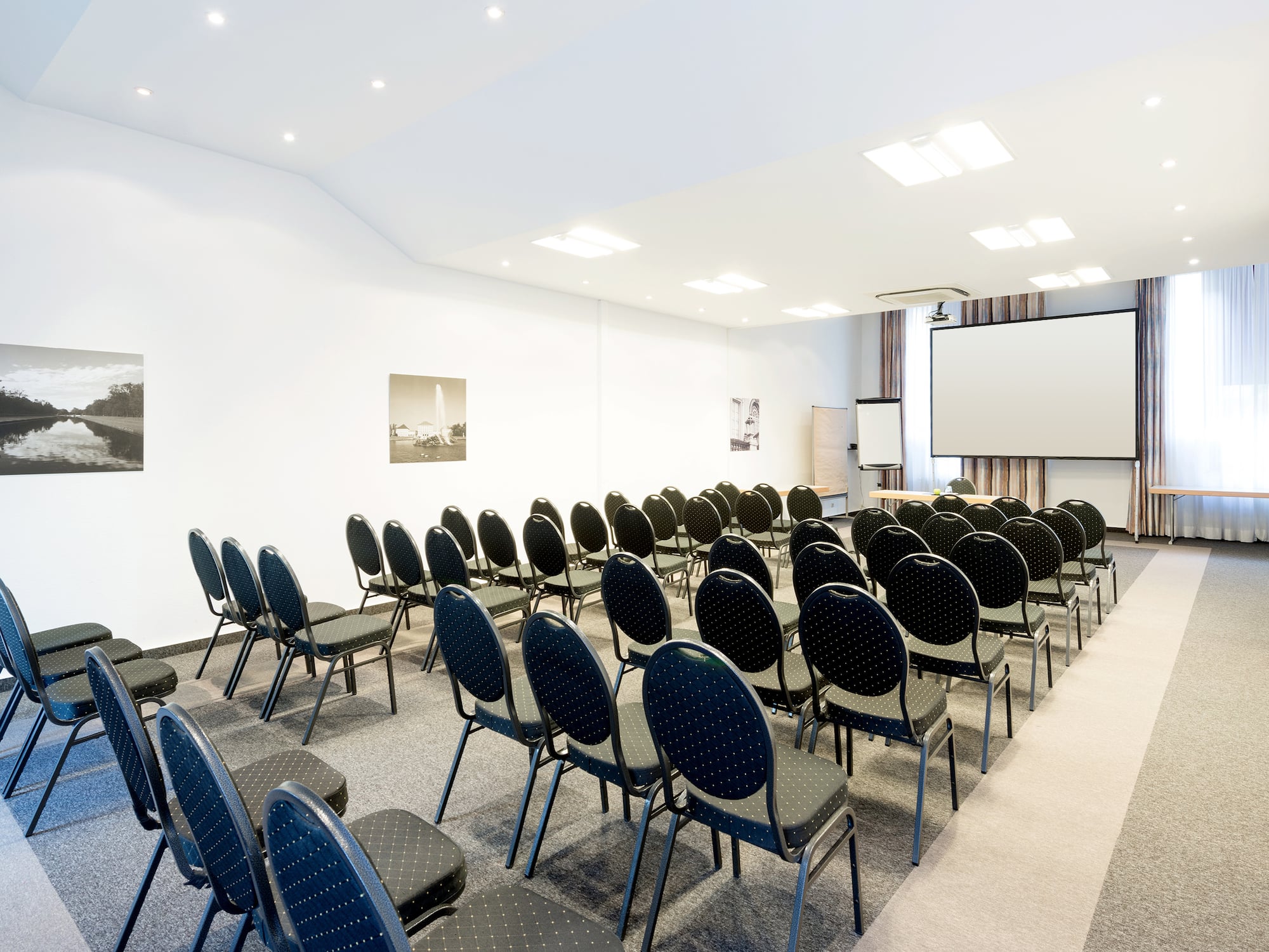 a room with rows of chairs