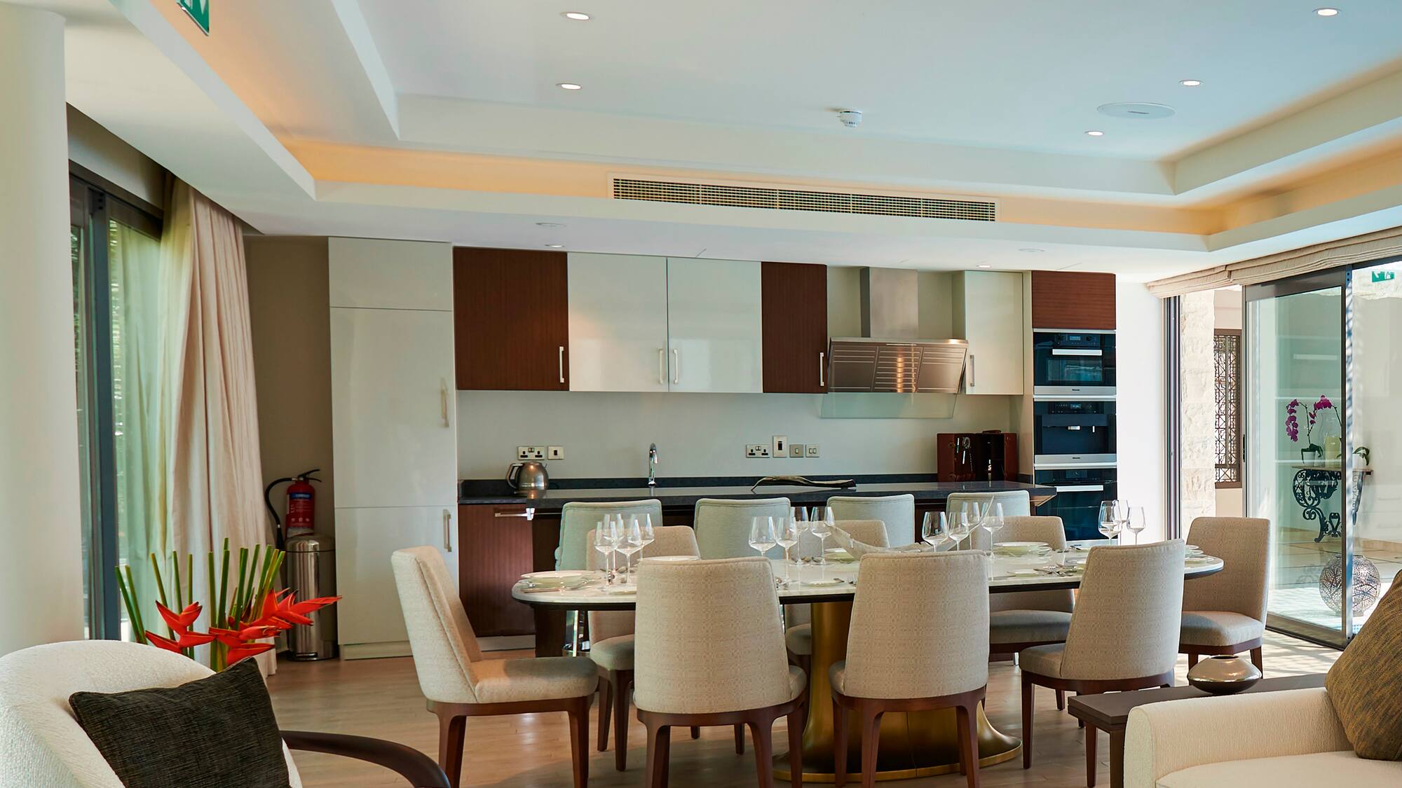 a dining room with a table and chairs