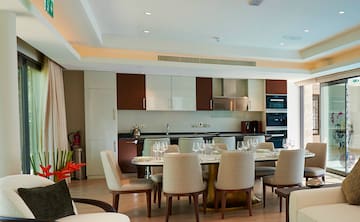 a dining room with a table and chairs