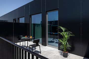 a black building with a table and chairs