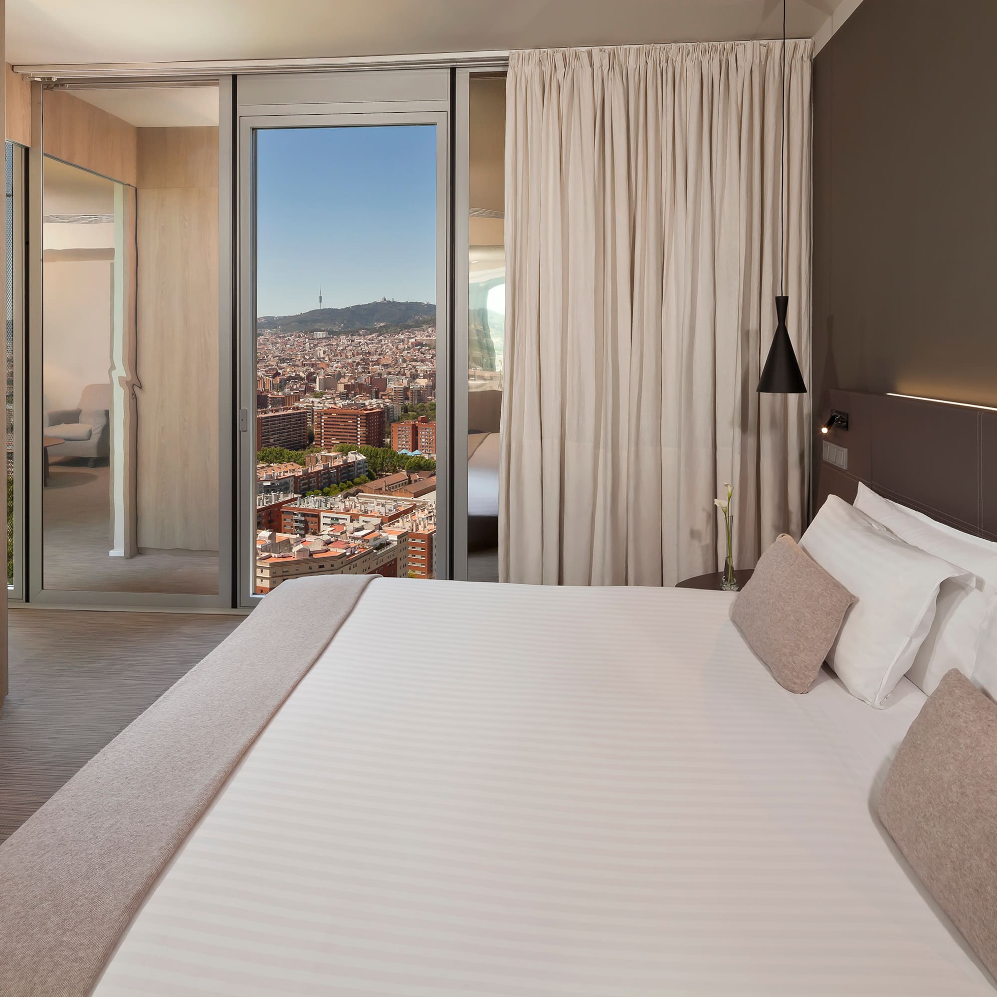 a bed with a view of a city