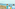 a group of people looking at a beach