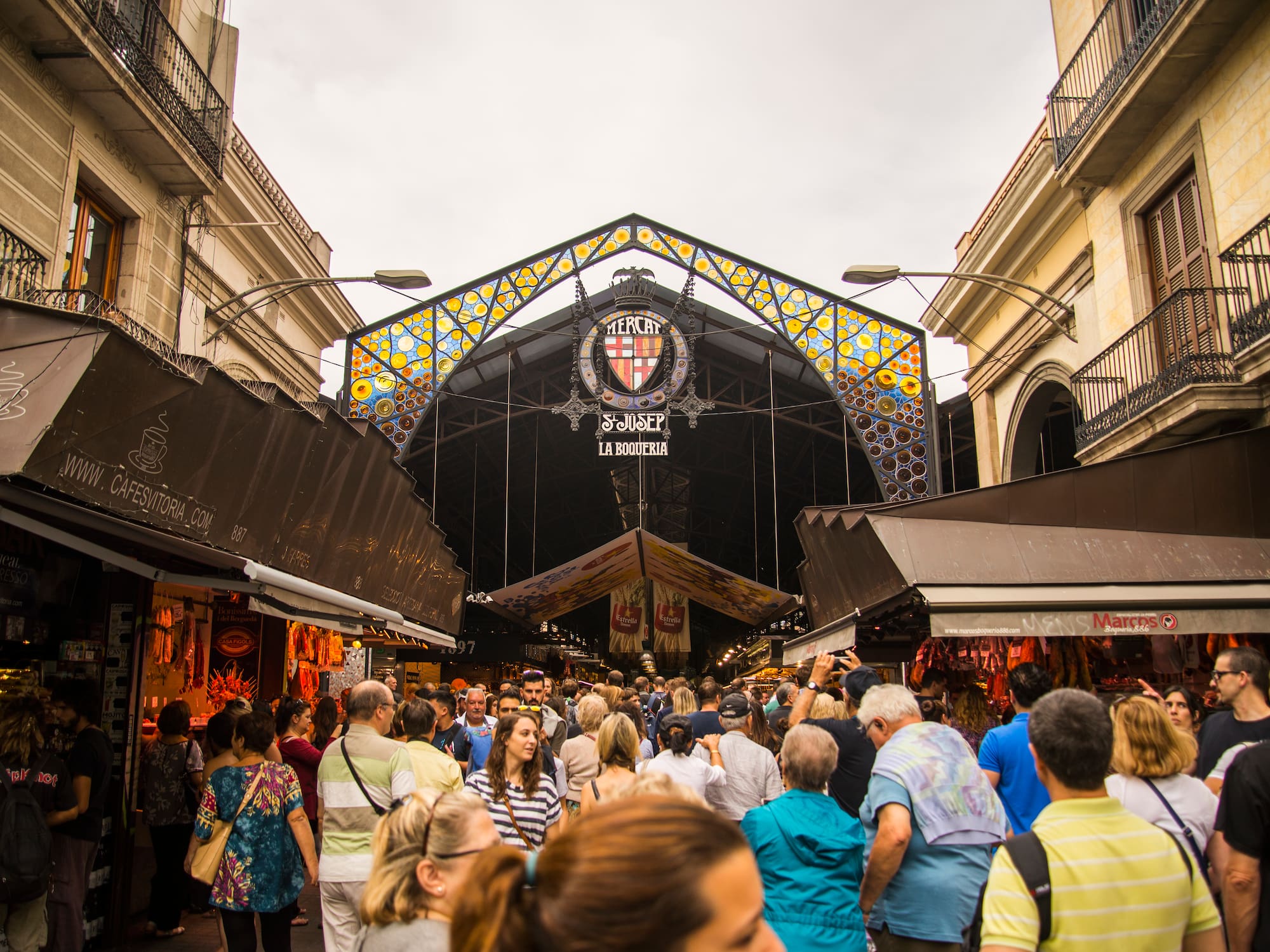 a crowd of people walking in a street