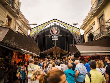 a crowd of people walking in a street