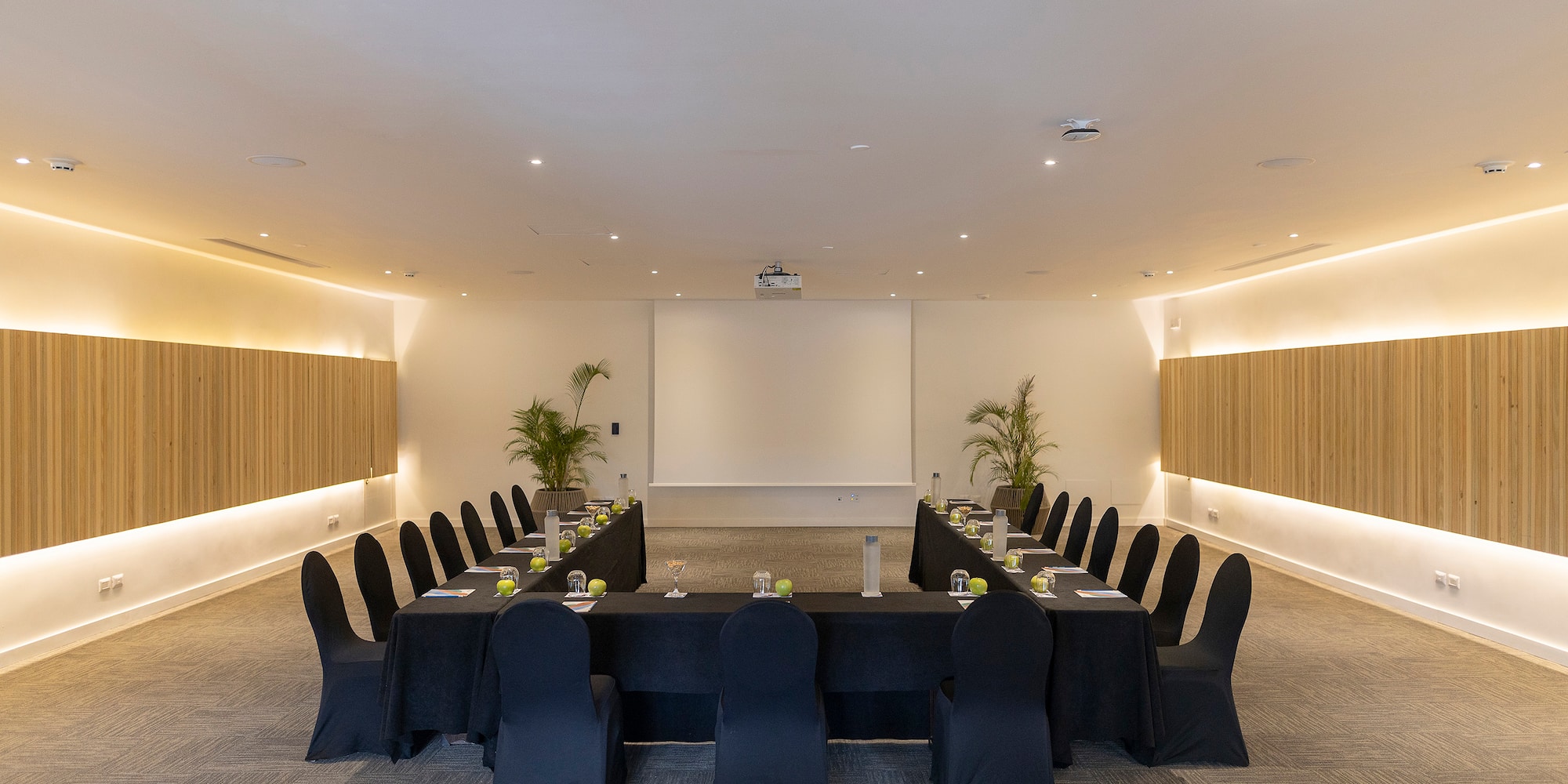 a room with a large table and chairs