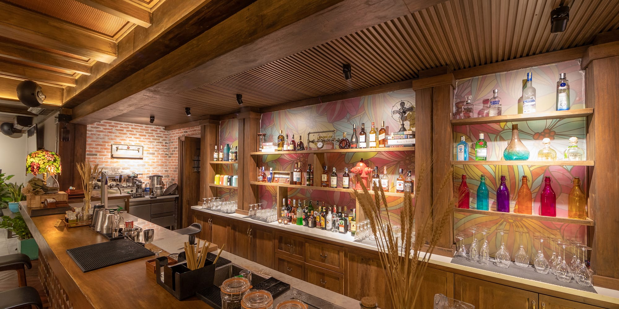 a bar with many bottles and shelves