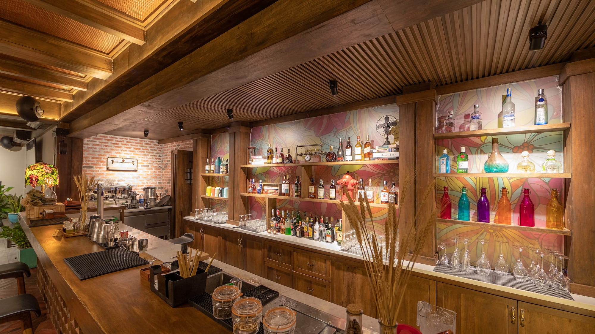 a bar with many bottles and shelves