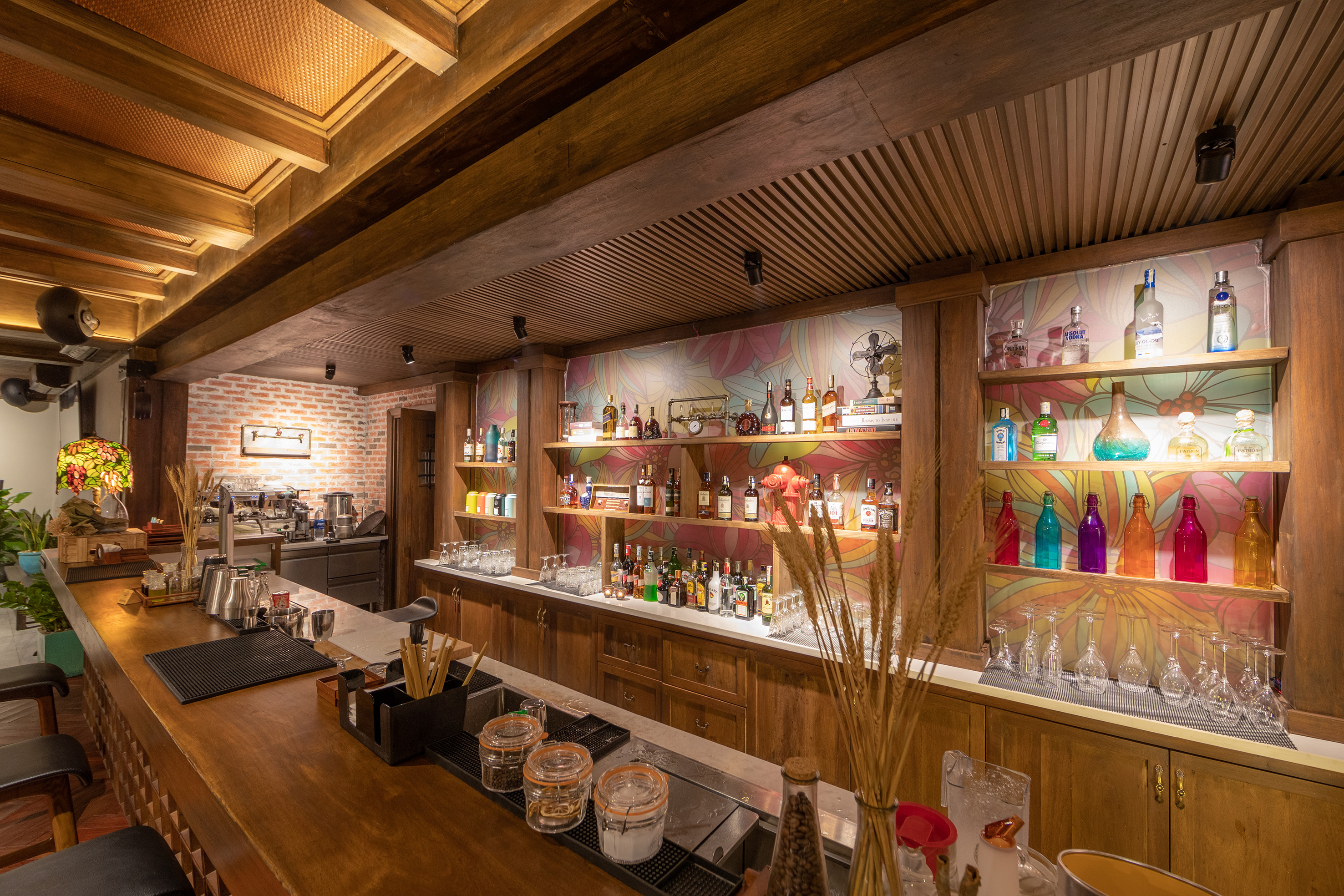a bar with many bottles and shelves