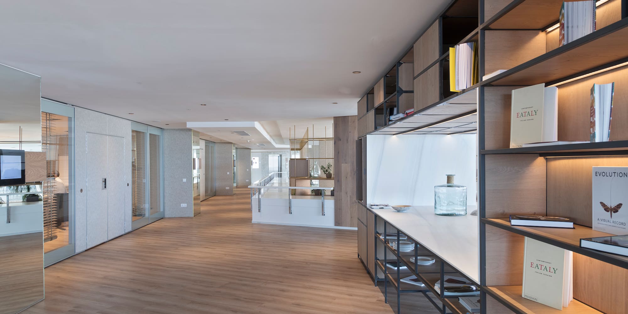 a room with shelves and a wood floor
