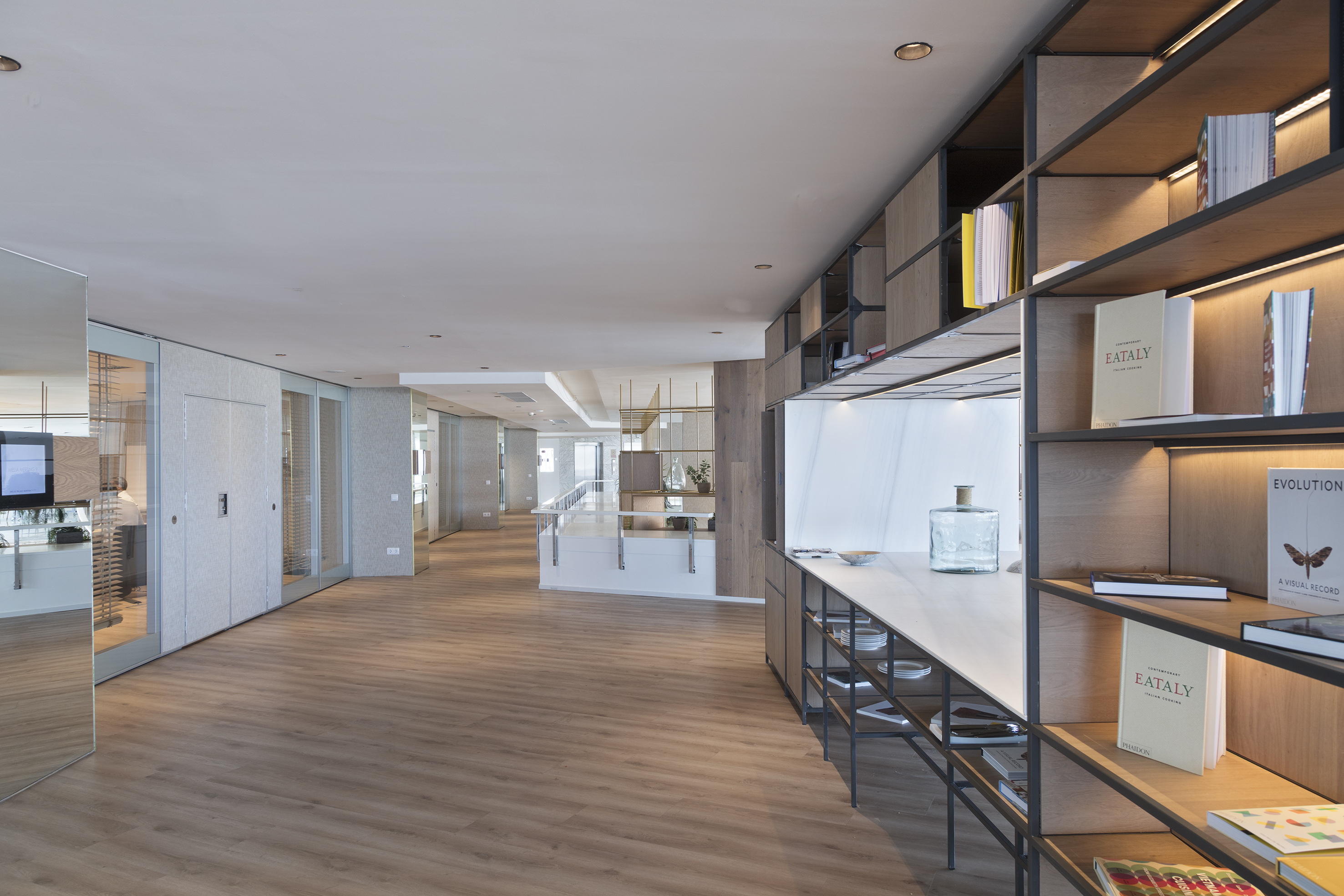 a room with shelves and a wood floor