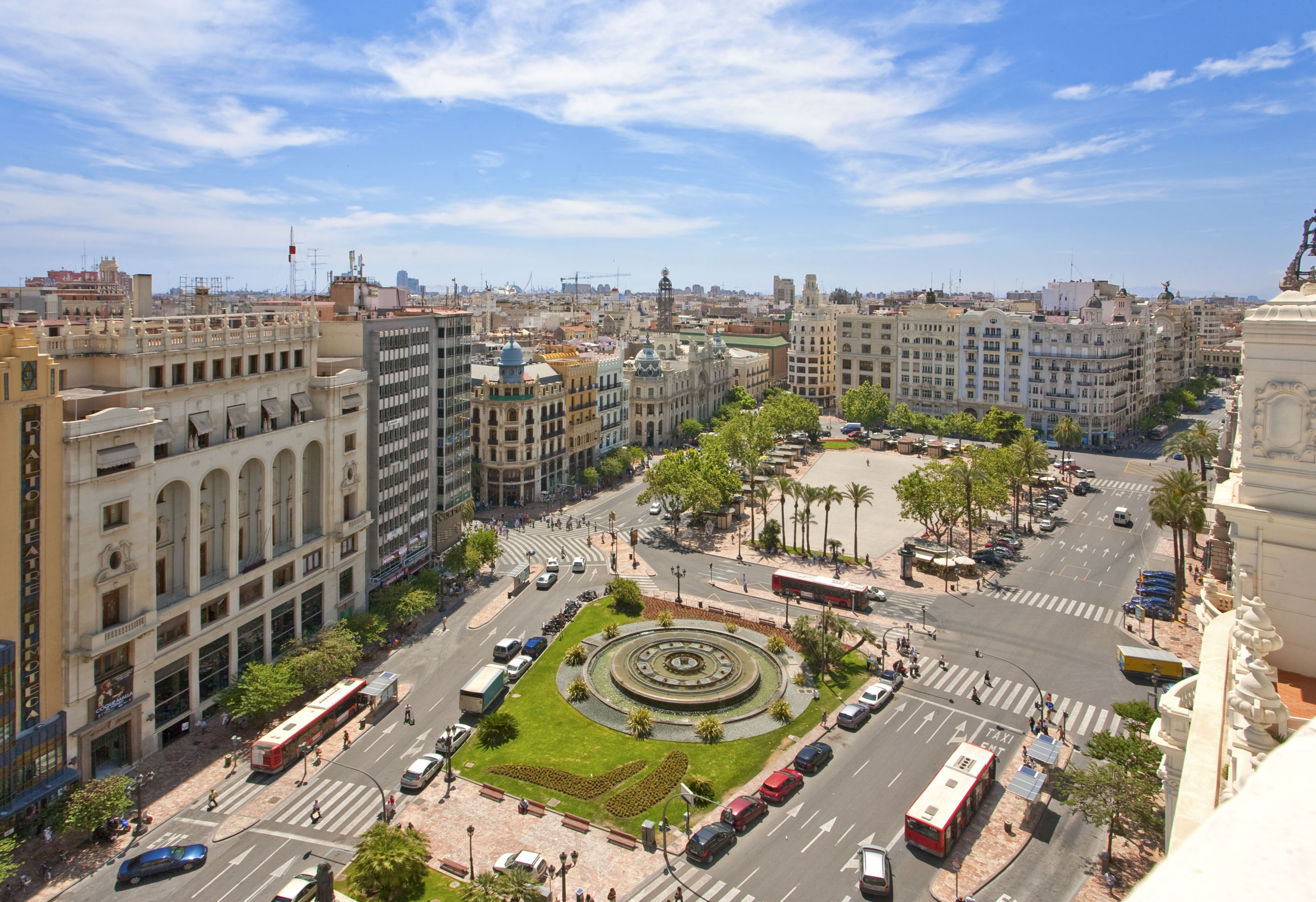 a city with a fountain and buildings