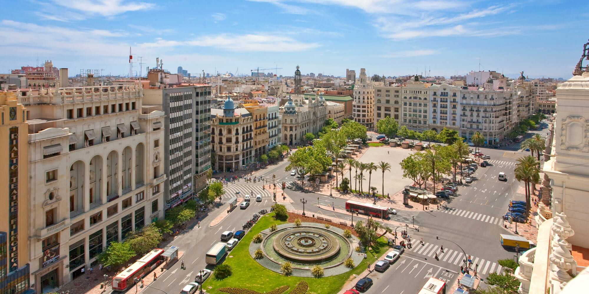 a city with a fountain and buildings