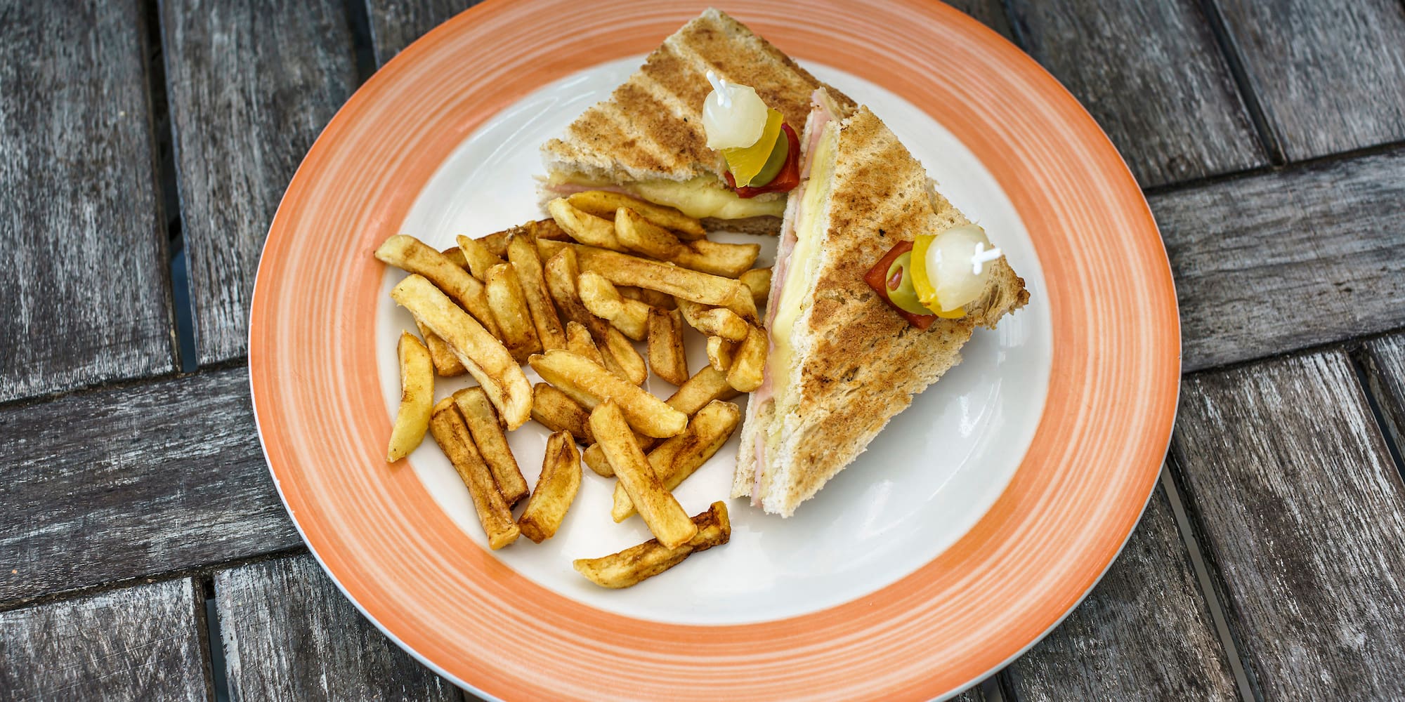 a plate of food on a wood table