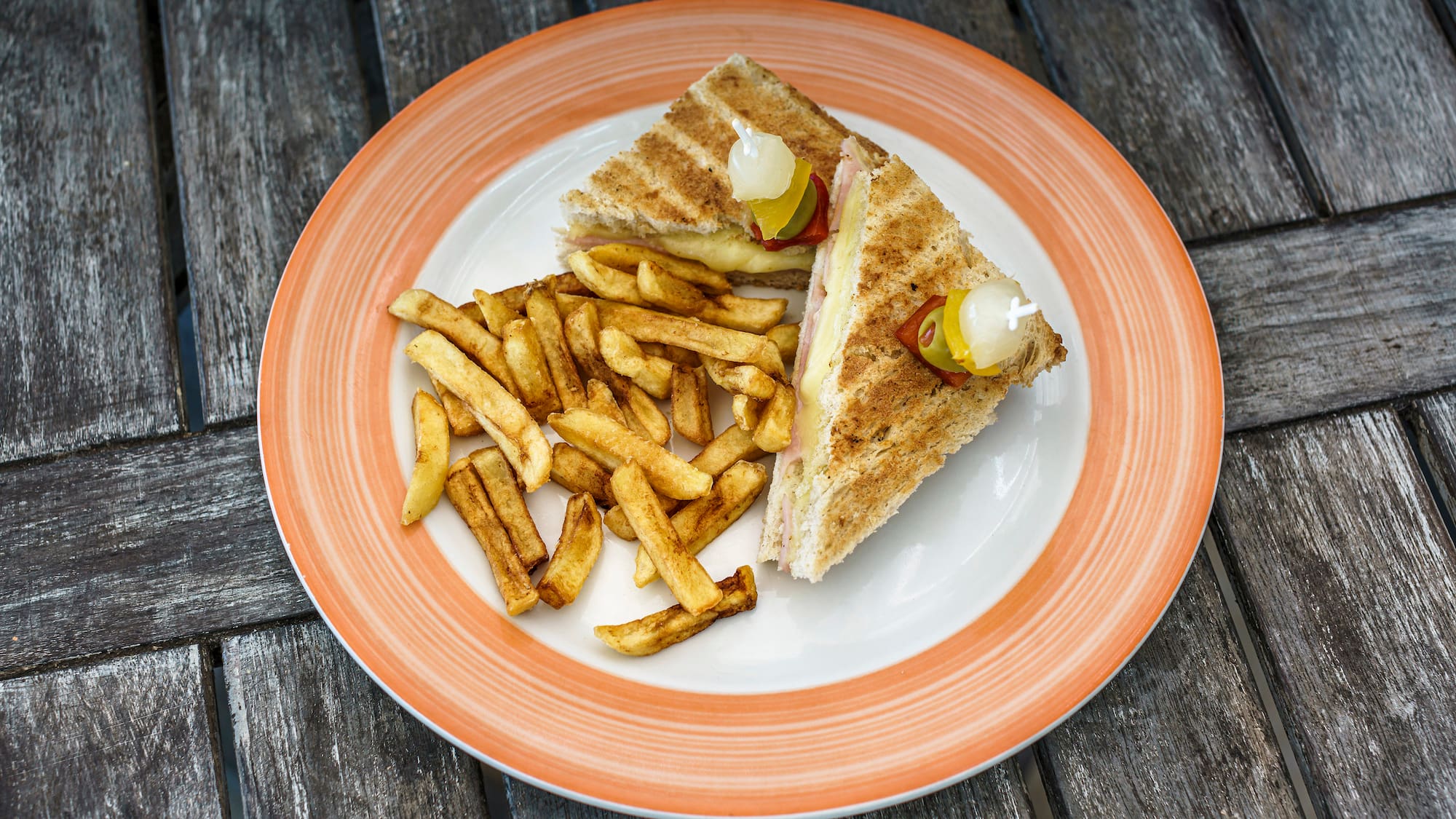 a plate of food on a wood table