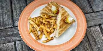 a plate of food on a wood table