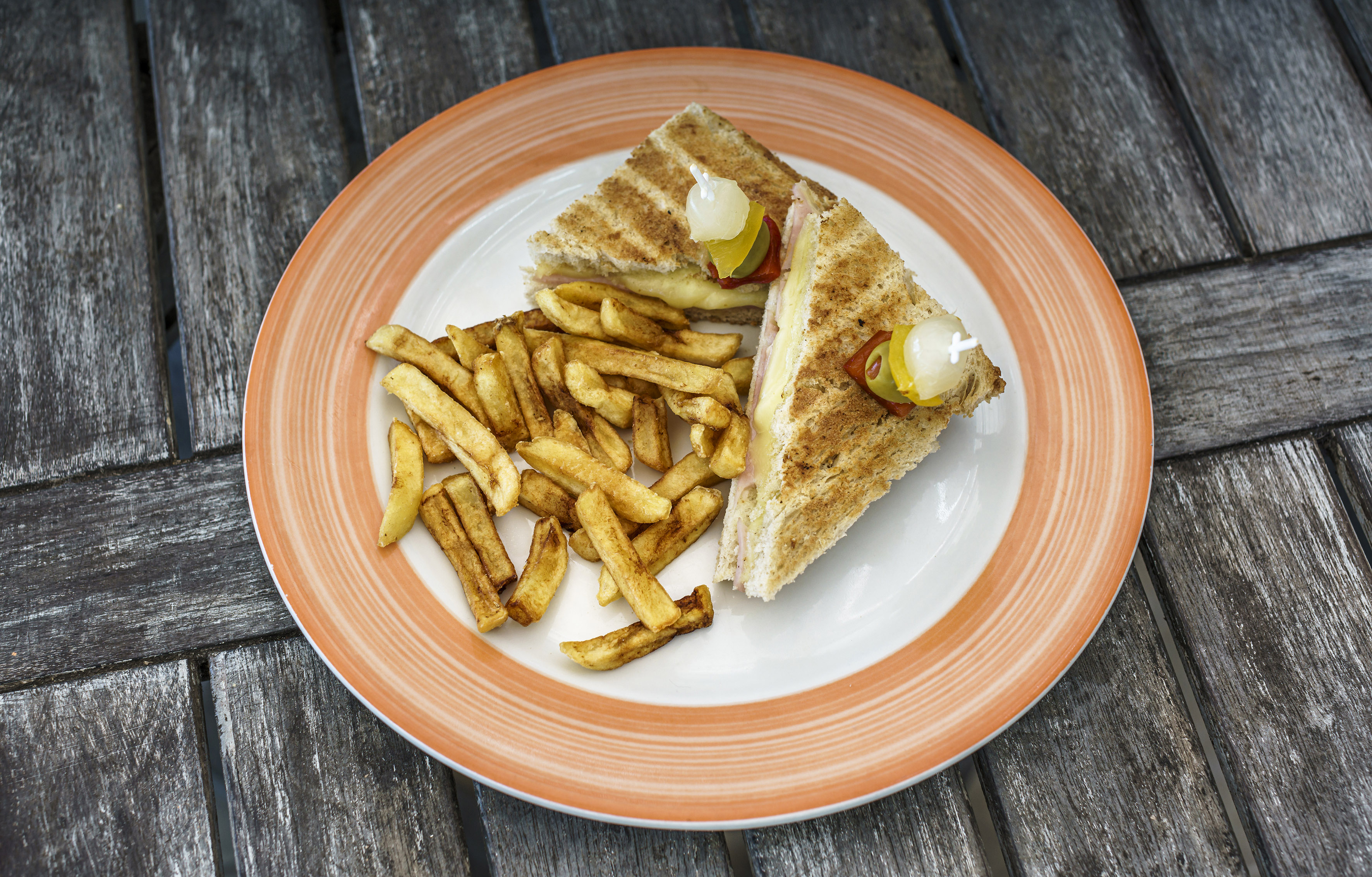 a plate of food on a wood table