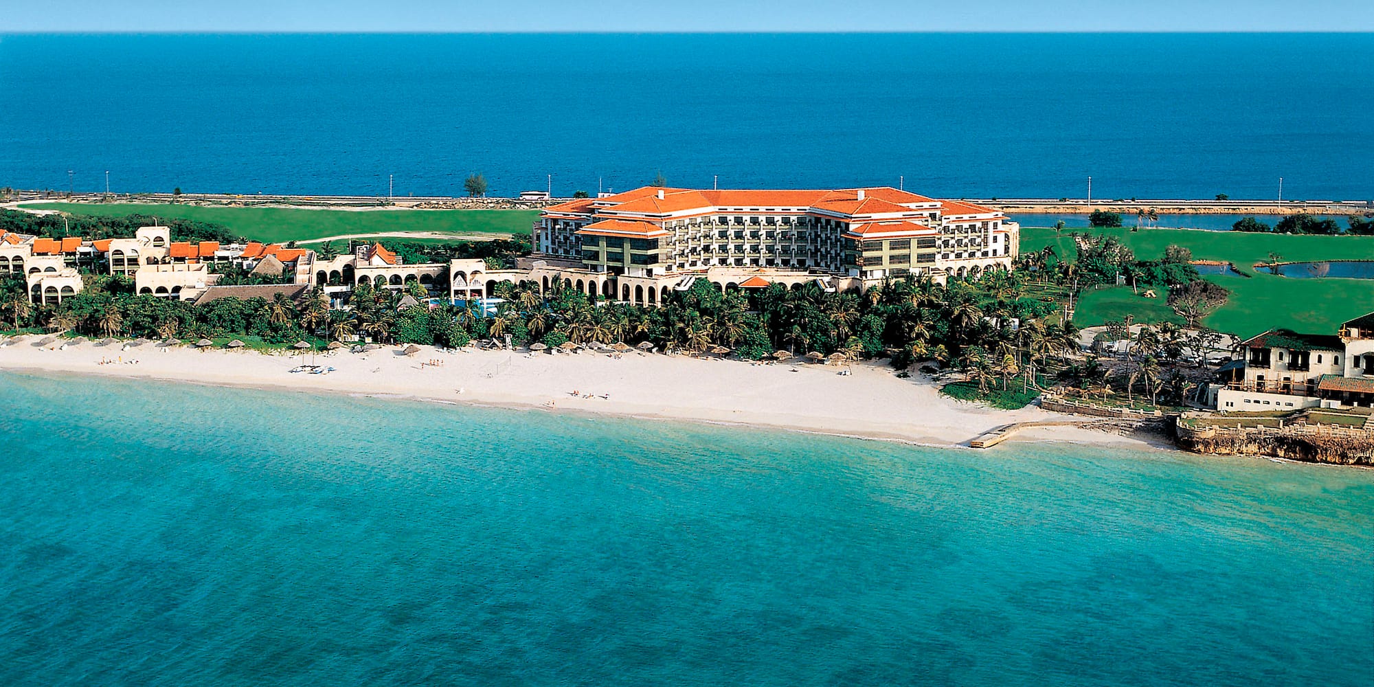 a large building on a beach