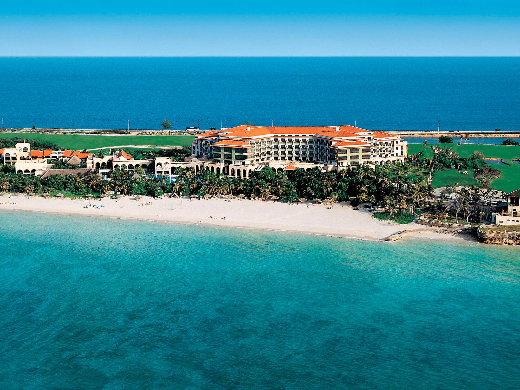 a large building on a beach