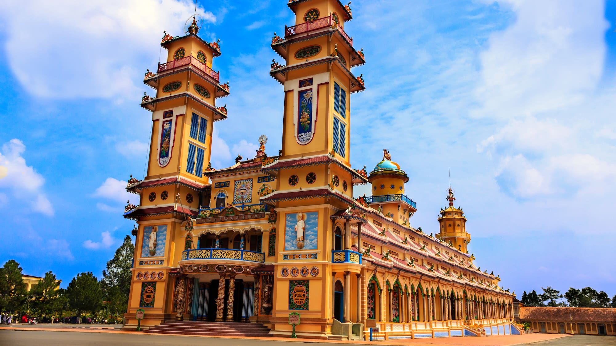 a building with towers and a street