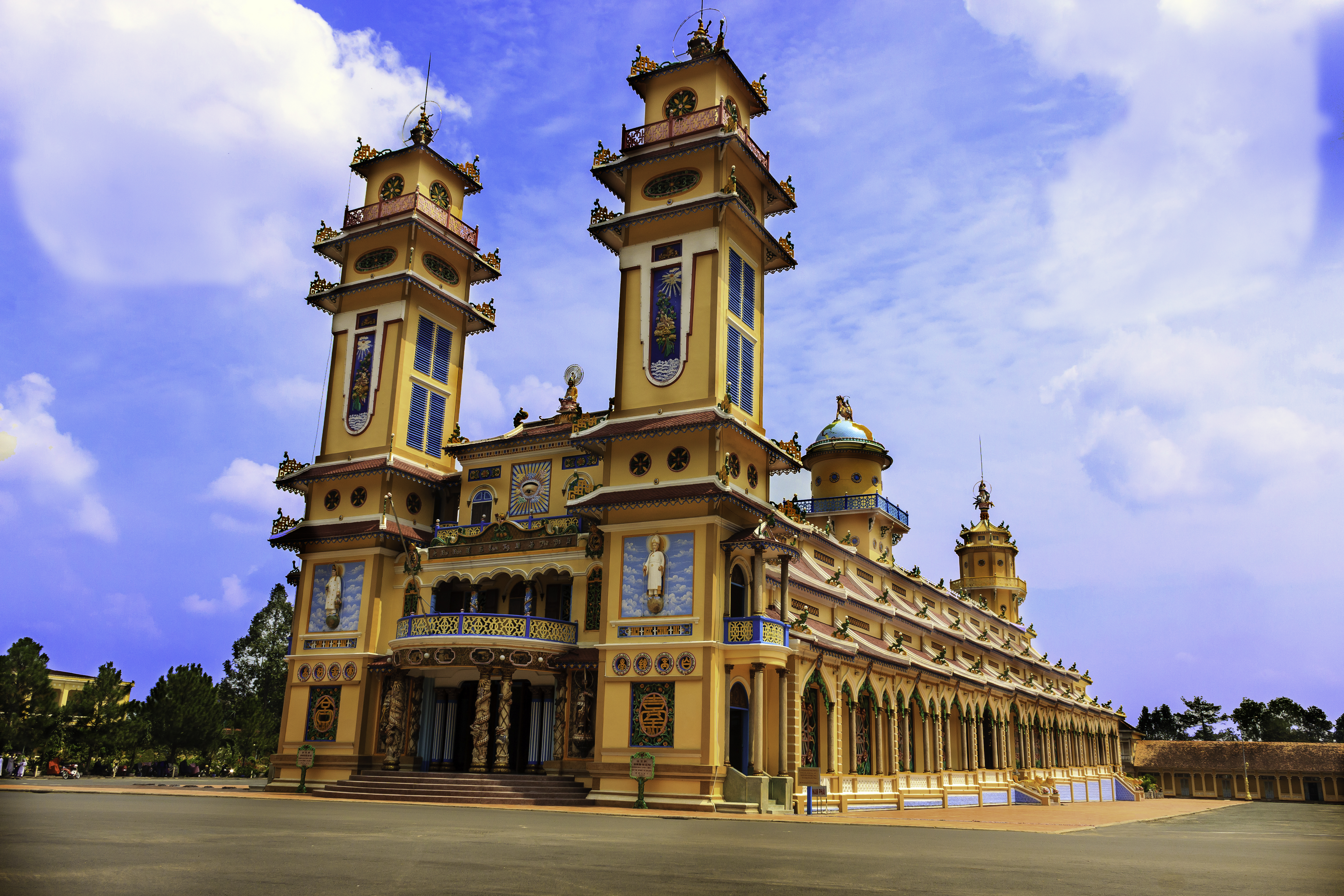 a building with towers and a street